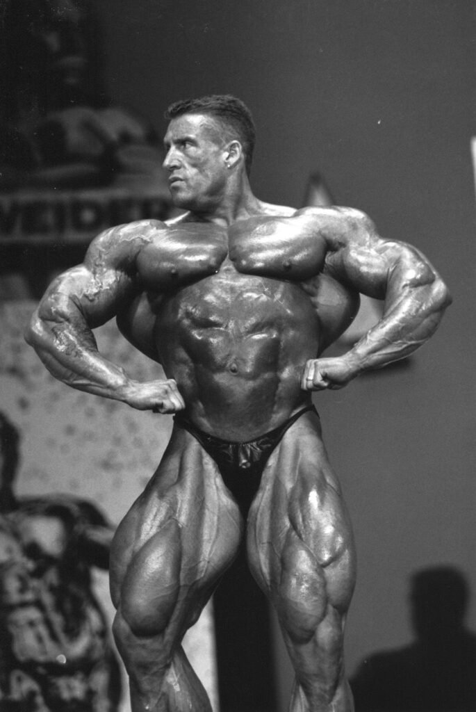 Dorian Yates lors du Mr. Olympia 1995, physique légendaire et méthode Blood and Guts